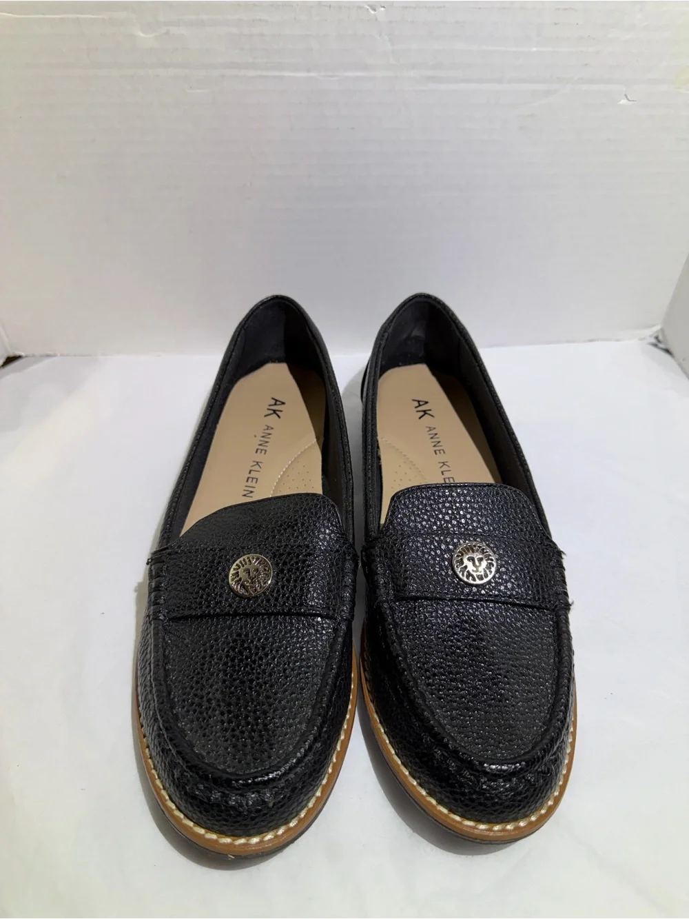 Anne Klein Black Textured Leather Loafers with Gold Emblem